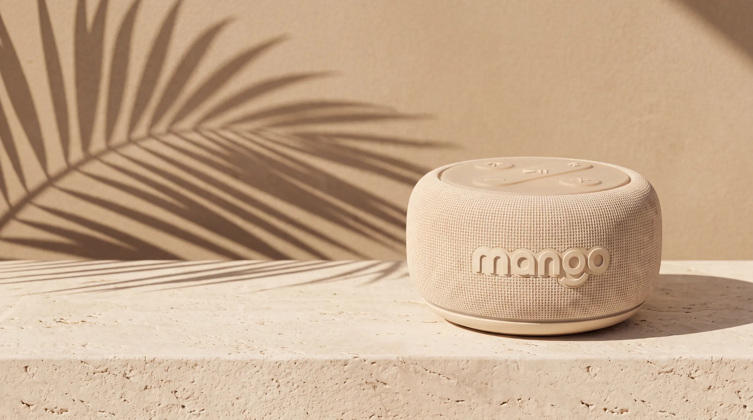 Cream Mango speaker on a sunlit limestone ledge with palm shadows