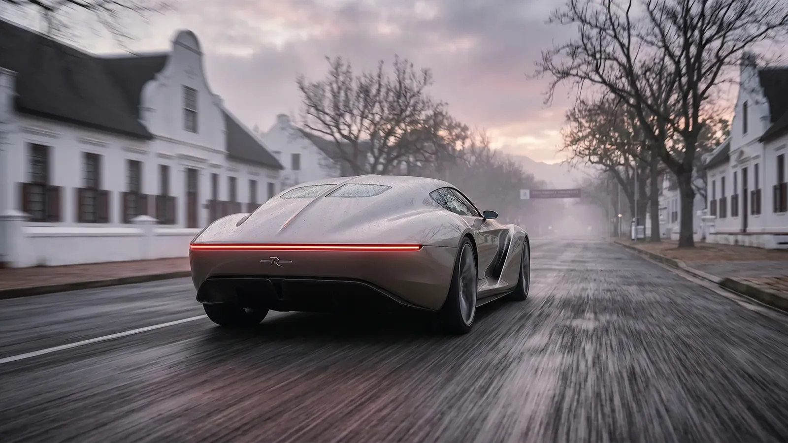 Rear of the Mirage concept car on a wet village street at dusk